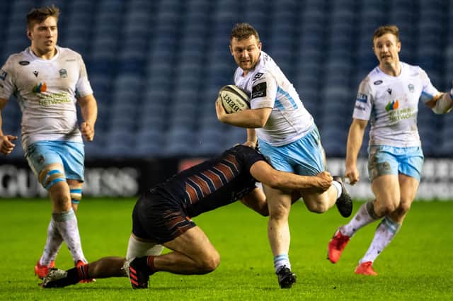 Glasgow took the game to Edinburgh for spells. Here Warriors centre Nick Grigg tries to get past Stuart McInally. Picture: Paul Devlin/SNS
