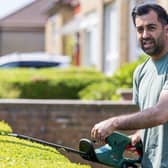 First Minister of Scotland Humza Yousaf tries his hand at hedge trimming during campaigning in Pollok (Pic: Robert Perry/PA Wire)