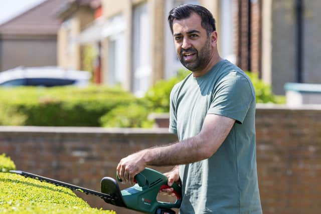 First Minister of Scotland Humza Yousaf tries his hand at hedge trimming during campaigning in Pollok (Pic: Robert Perry/PA Wire)