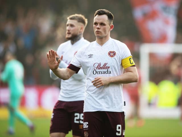 Hearts striker Lawrence Shankland has been called into the Scotland squad.