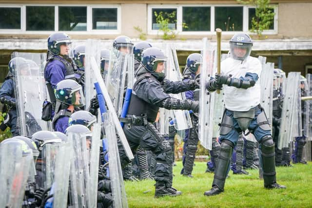 Police Scotland officers take part in a role-play exercise recreating a protest during a COP26 public order training at Craigiehall Army barracks. Picture: Jane Barlow/PA Wire