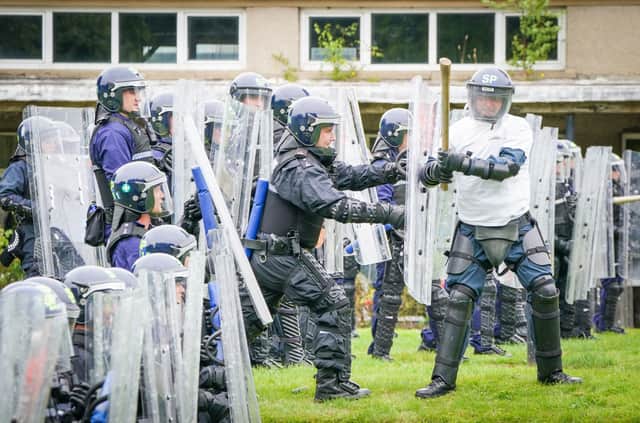 Police Scotland officers take part in a role-play exercise recreating a protest during a COP26 public order training at Craigiehall Army barracks. Picture: Jane Barlow/PA Wire