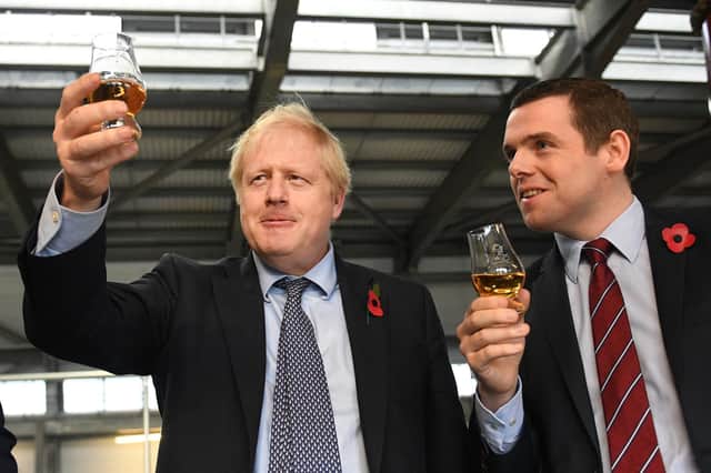 Prime Minister Boris Johnson with Douglas Ross on a campaigning visit