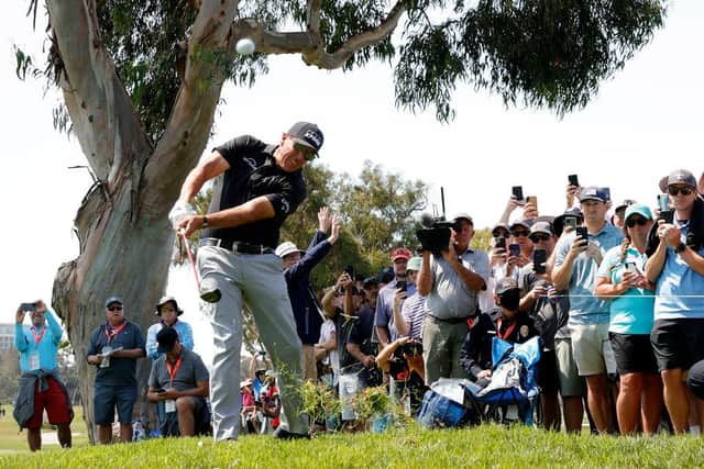 Phil Mickelson plays from the rough on the 15th hole as a gallery of fans look on during the first round of the 2021 US Open at Torrey Pines in San Diego. Picture: Ezra Shaw/Getty Images.