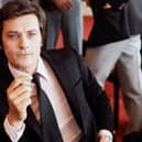 ​Alain Delon, pictured here in 1971, was often described as the most beautiful man in the world (Picture: AFP via Getty Images)