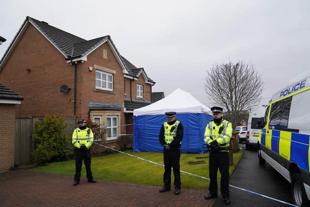 Officers from Police Scotland stand outside the home of Peter Murrell and Nicola Sturgeon. Picture: Andrew Milligan/PA Wire