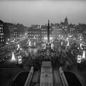 Glasgow's George Square, as viewed from the City Chambers, lit up by festive decorations in 1963.