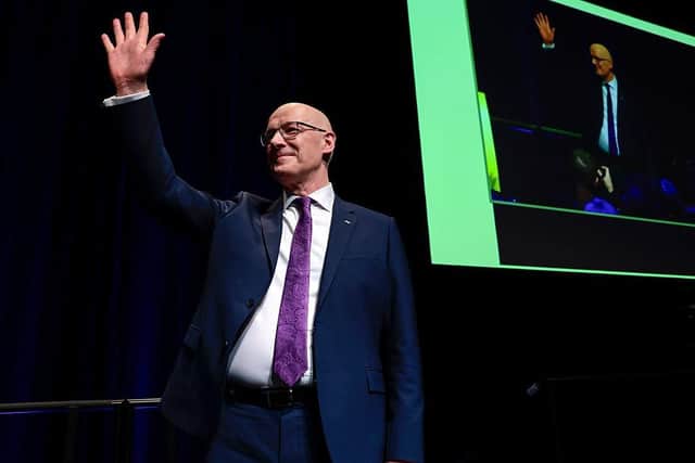 First Minister and SNP leader John Swinney acknowledges applause after addressing the SNP campaign Conference at Edinburgh International Conference Centre on Saturday (Picture: Jeff J Mitchell/Getty Images)