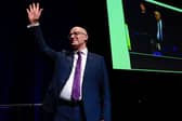 First Minister and SNP leader John Swinney acknowledges applause after addressing the SNP campaign Conference at Edinburgh International Conference Centre on Saturday (Picture: Jeff J Mitchell/Getty Images)