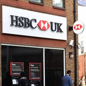 EMBARGOED TO 0001 WEDNESDAY APRIL 13 File photo dated 24/01/17 of a customer using a cash machine at a branch of HSBC in Tooting Broadway, London, as people experiencing domestic abuse can now walk into any HSBC branch in the UK to access a safe space and seek support and advice.
