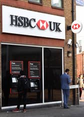 EMBARGOED TO 0001 WEDNESDAY APRIL 13 File photo dated 24/01/17 of a customer using a cash machine at a branch of HSBC in Tooting Broadway, London, as people experiencing domestic abuse can now walk into any HSBC branch in the UK to access a safe space and seek support and advice.