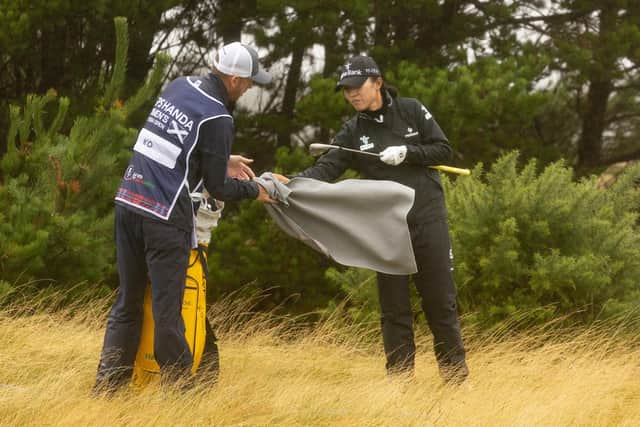 Lydia Ko gets some help drying a club from her Scottish caddie Paul Cormack during the first round of the ISPS HANDA Women's Scottish Open at Dundonald Links. Picture: Tristan Jones/LET