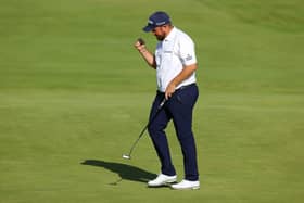 Shane Lowry reacts after holing a par putt on the 18th in the third round of the 149th Open at Royal St George’s. Picture: Andrew Redington/Getty Images.