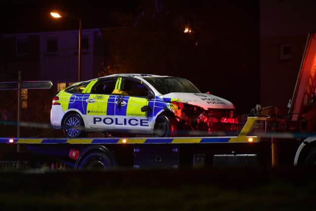 The police car looks badly smashed with the front-end crushed following the nasty collision.