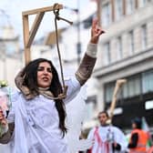 A protester poses in mock gallows during a rally held in central London this month against the Iranian regime (Picture: Justin Tallis/AFP via Getty Images)