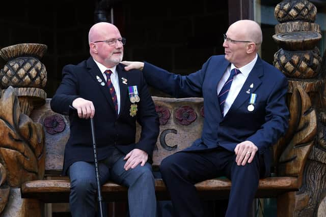 Falklands War veterans Bill McDowall (left) and  Norman 'Mac' McDade in the grounds of The Erskine Home in Bishopton, Renfrewshire, as they meet for the first time since the war. PIC: Andrew Milligan/PA Wire