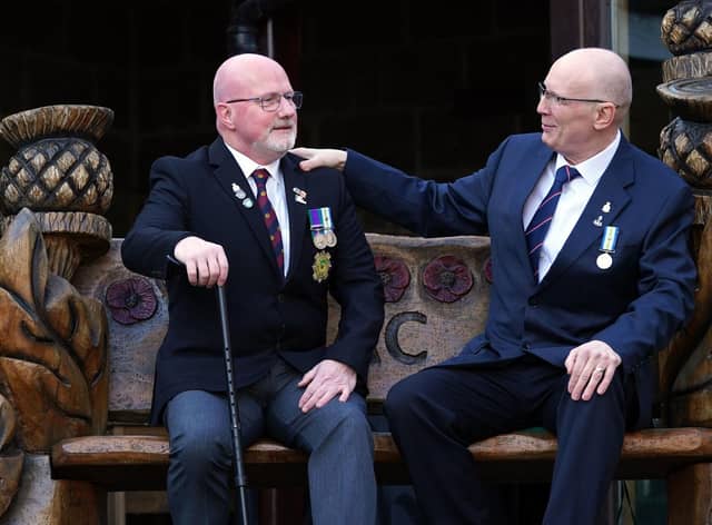 Falklands War veterans Bill McDowall (left) and  Norman 'Mac' McDade in the grounds of The Erskine Home in Bishopton, Renfrewshire, as they meet for the first time since the war. PIC: Andrew Milligan/PA Wire