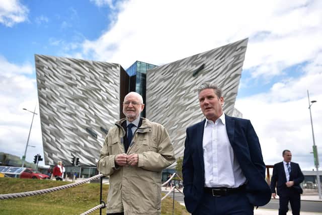 Labour party leader Sir Keir Starmer (right) walks with Desmond Rea, former chairman of the NI Policing Board, outside the Titanic visitor building. Picture: Charles McQuillan/Getty Images
