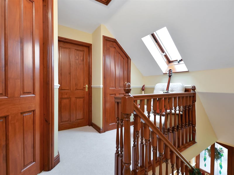 With loft hatch, storage cupboard and roof window.