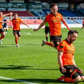 Nicky Clark celebrates netting the winning goal for Dundee United. Picture: SNS