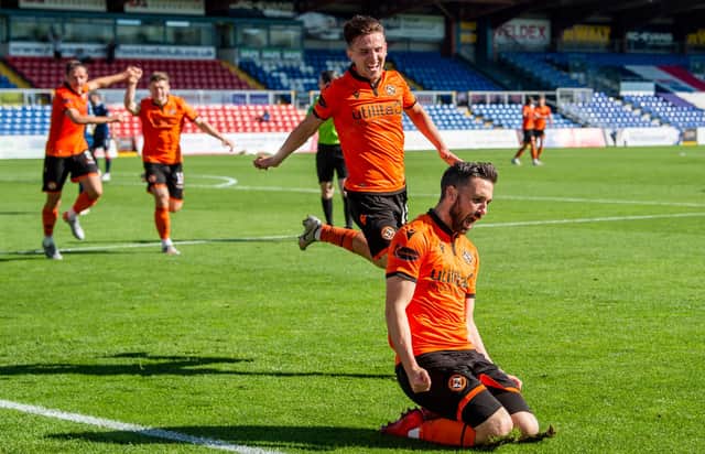 Nicky Clark celebrates netting the winning goal for Dundee United. Picture: SNS