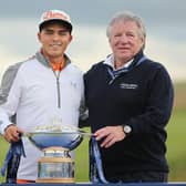 Martin Gilbert, pictured with Rickie Fowler after the American's win in the 2015 Aberdeen Standard Investments Scottish Open at Gullane, is set to take over as Scottish Golf's new chair this weekend. Picture: Mike Ehrmann/Getty Images.