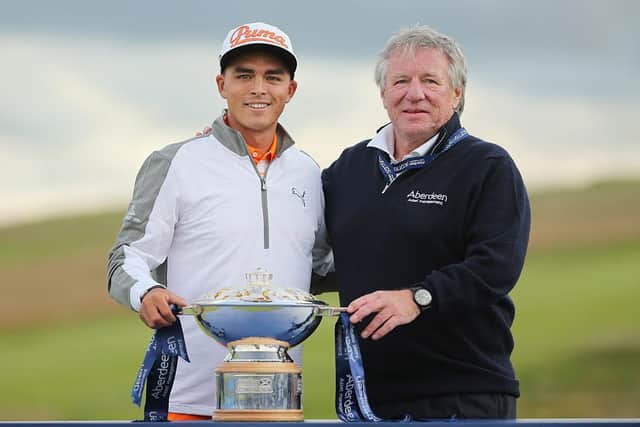 Martin Gilbert, pictured with Rickie Fowler after the American's win in the 2015 Aberdeen Standard Investments Scottish Open at Gullane, is set to take over as Scottish Golf's new chair this weekend. Picture: Mike Ehrmann/Getty Images.