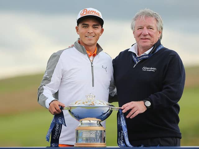 Martin Gilbert, pictured with Rickie Fowler after the American's win in the 2015 Aberdeen Standard Investments Scottish Open at Gullane, is set to take over as Scottish Golf's new chair this weekend. Picture: Mike Ehrmann/Getty Images.