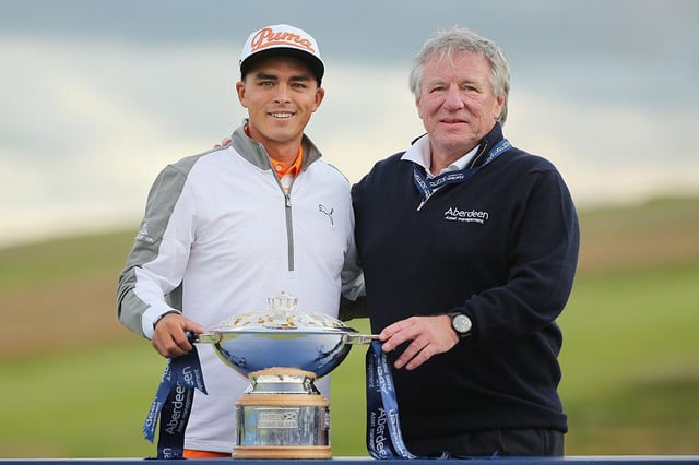 Martin Gilbert, pictured with Rickie Fowler after the American's win in the 2015 Aberdeen Standard Investments Scottish Open at Gullane, is set to take over as Scottish Golf's new chair this weekend. Picture: Mike Ehrmann/Getty Images.