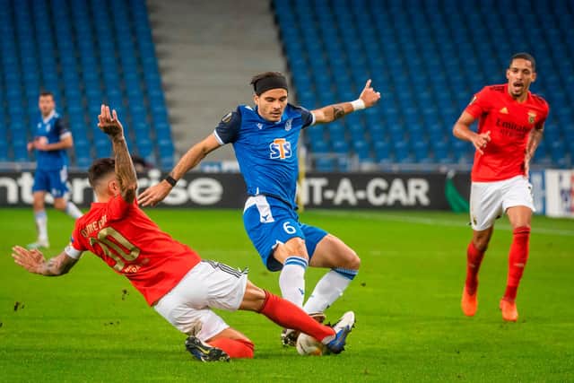 Benfica's Nicolas Otamendi in the thick of the action against Poznan last week (Photo by Wojtek RADWANSKI / AFP) (Photo by WOJTEK RADWANSKI/AFP via Getty Images)