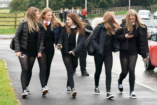 Pupils arrive at Kelso High School on the Scottish Borders as schools in Scotland start reopening on Tuesday amid concerns about the safety of returning to the classroom during the coronavirus pandemic. PA Photo. Picture date: Tuesday August 11, 2020. See PA story EDUCATON Schools. Photo credit should read: Owen Humphreys/PA Wire