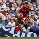 Toulouse's Scottish full-back Blair Kinghorn (L) is tackled by Leinster's Irish scrum-half Jamison Gibson-Park.