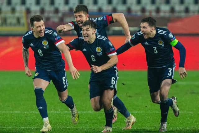 Scotland's players celebrate after David Marshall saves Aleksandar Mitrović's penalty (Photo by Nikola Krstic / SNS Group)