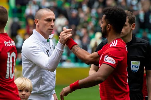 Celtic's Scott Brown (left) with Aberdeen's Shay Logan in Settember 2018. (Picture: SNS)