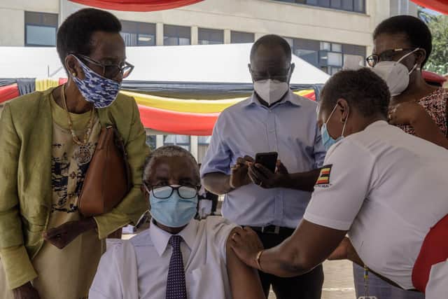A Ugandan doctor receives a dose of the Oxford/AstraZeneca Covid vaccine at a hospital in Kampala last month (Picture: Badru Katumba/AFP via Getty Images)