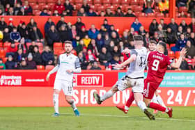 Christian Ramirez scores to make it 2-0 to Aberdeen.