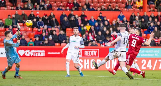 Christian Ramirez scores to make it 2-0 to Aberdeen.