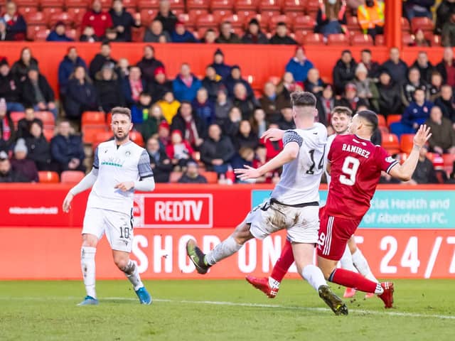 Christian Ramirez scores to make it 2-0 to Aberdeen.