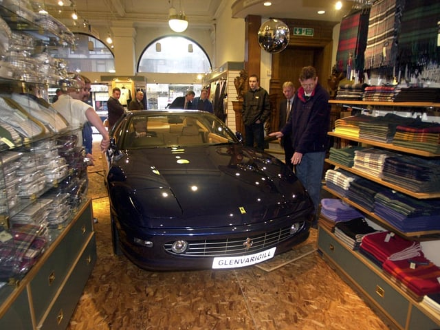 A Ferrari 465M is seen here being driven through the men's department to launch the stores Italian ‘La Dolce Vita’ promotion. Year: 2001
