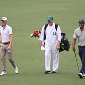 Justin Thomas walks up the eighth fairway with Tiger Woods and his caddie Joe LaCava during a practice round prior to the 2023 Masters at Augusta National Golf Club. Picture: Ross Kinnaird/Getty Images.