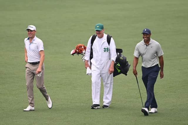 Justin Thomas walks up the eighth fairway with Tiger Woods and his caddie Joe LaCava during a practice round prior to the 2023 Masters at Augusta National Golf Club. Picture: Ross Kinnaird/Getty Images.