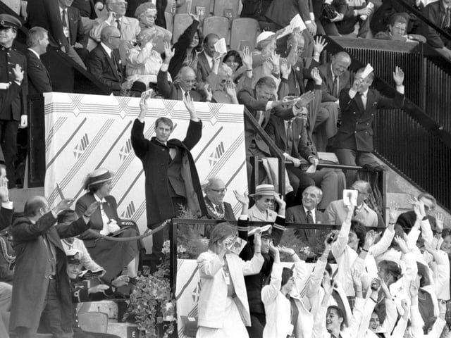Prince Edward and some other VIPs join in the 'Mexican Wave' during the athletics at the Edinburgh Commonwealth Games 1986. The Queen remained seated.