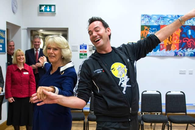 President of the Royal Osteoporosis Society Camilla, Duchess of Cornwall, and Strictly Come Dancing judge Craig Revel Horwood dance the cha-cha-cha. Dancing is one way to help keep bones healthy (Picture: Arthur Edwards/WPA pool/Getty Images)