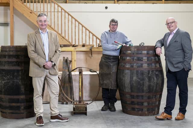Adam Hardie, business development partner and head of food and drink at Johnston Carmicahel; Gary Drummond, founder of the Trossachs Cooperage; and Alan Wright at the Trossachs Cooperage in Callander.