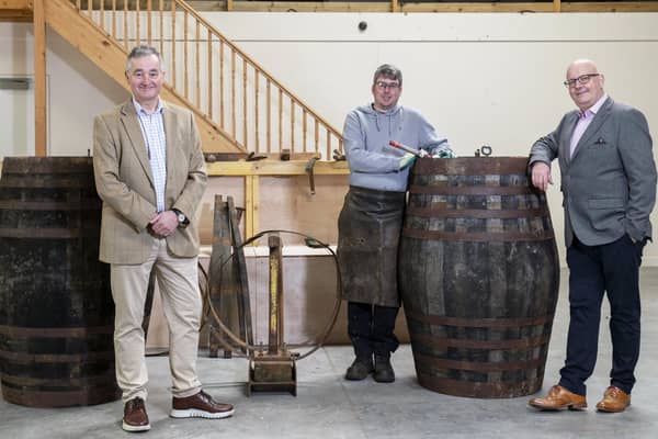 Adam Hardie, business development partner and head of food and drink at Johnston Carmicahel; Gary Drummond, founder of the Trossachs Cooperage; and Alan Wright at the Trossachs Cooperage in Callander.