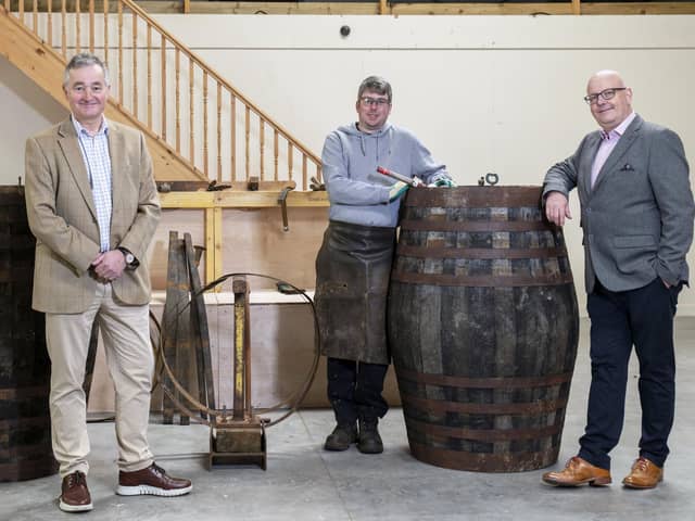 Adam Hardie, business development partner and head of food and drink at Johnston Carmicahel; Gary Drummond, founder of the Trossachs Cooperage; and Alan Wright at the Trossachs Cooperage in Callander.