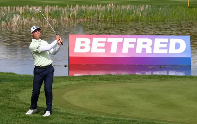 Calum Hill chips on to the 18th green during the first round of The Betfred British Masters hosted by Danny Willett at The Belfry. Picture: Richard Heathcote/Getty Images.