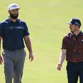 Jon Rahm and Connor Syme chat during their second round in the DP World Tour Championship on the Earth Course at Jumeirah Golf Estates in Dubai. Picture: Ross Kinnaird/Getty Images.