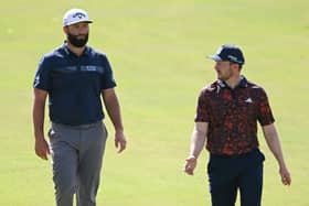Jon Rahm and Connor Syme chat during their second round in the DP World Tour Championship on the Earth Course at Jumeirah Golf Estates in Dubai. Picture: Ross Kinnaird/Getty Images.
