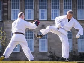 The Lib Dem leader taking part in a karate lesson with Robert Steggles at the Meadows.  Pic: Jane Barlow